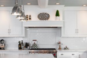 kitchen with white cupboards and tile