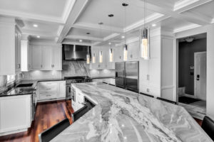 large kitchen with stone countertops