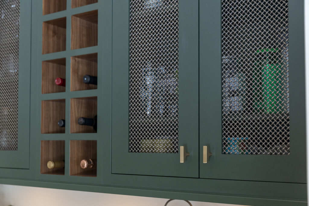 Green cabinetry detail including wine storage