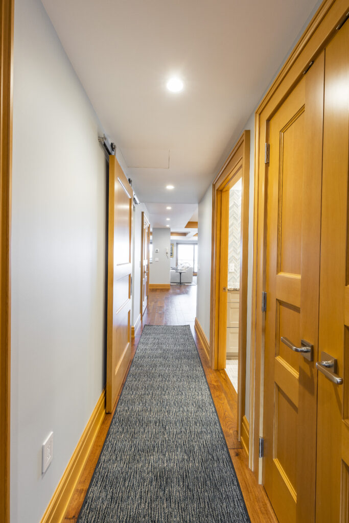 Hallway detail showcasing newly installed trim and doors