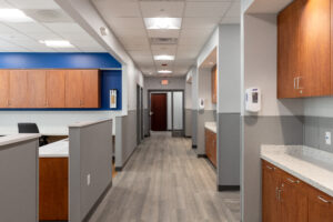 R.E. McNamara Inc.'s renovation project displaying light custom cabinetry, white countertops, and an improved layout for Planned Parenthood office space.