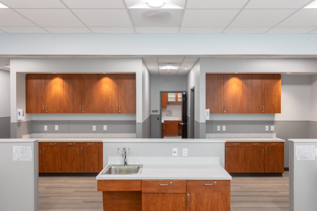 Renovated Planned Parenthood space with white counters and light-colored cabinetry, designed by R.E. McNamara Inc.