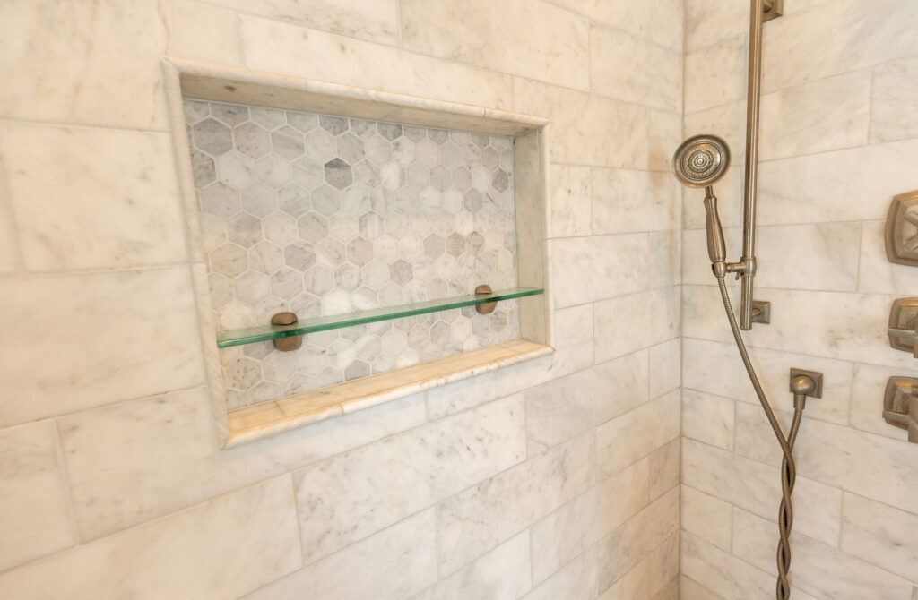 Meadow Interior Renovation shower tiling with built-in shelf
