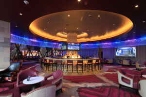 Lounge and bar area at Seneca Niagara Casino with LED-illuminated crystal ring and luxurious finishes.