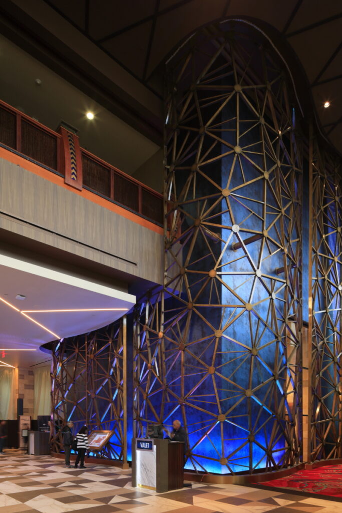 Modern decorative installation in Seneca Niagara Casino by R.E. McNamara Inc., featuring sleek wood accents and contemporary LED lighting as part of their renovation services.