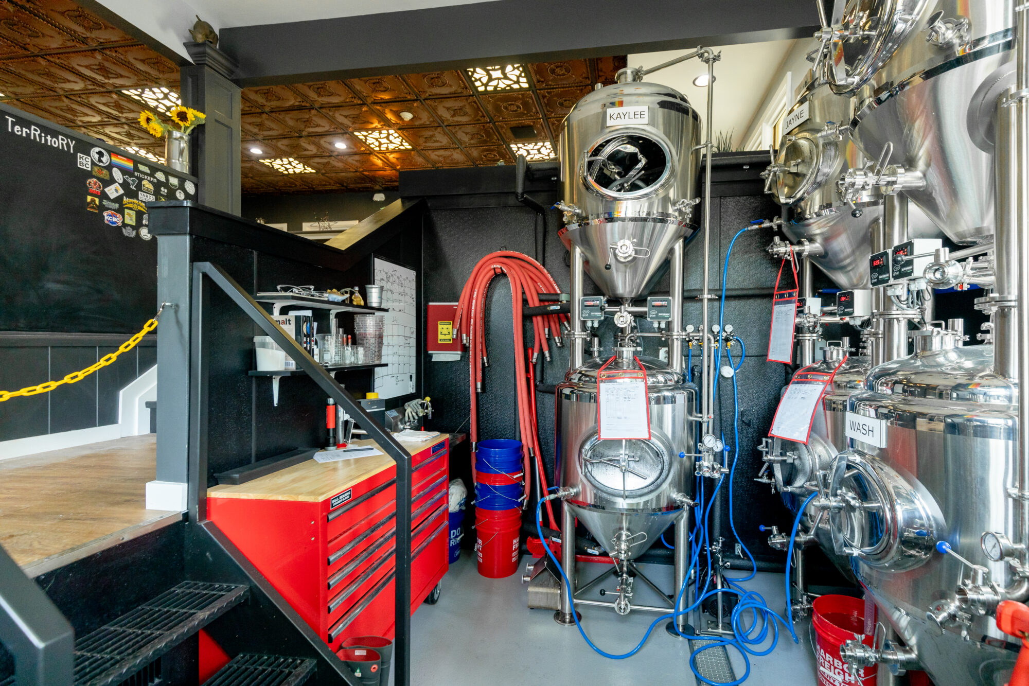 Comprehensive renovation at One Eyed Cat Brewing showcasing brewing machinery.