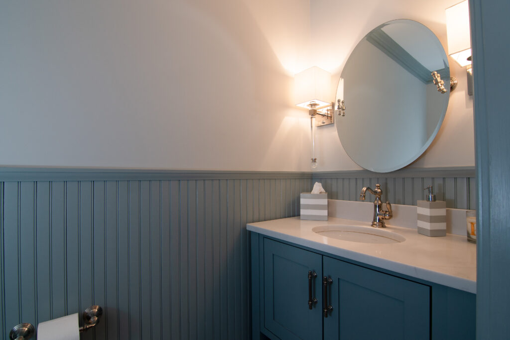 Stunning bathroom renovation featuring teal accents, including a stylish vanity and modern fixtures, expertly completed by R.E. McNamara Inc.'s experienced team.